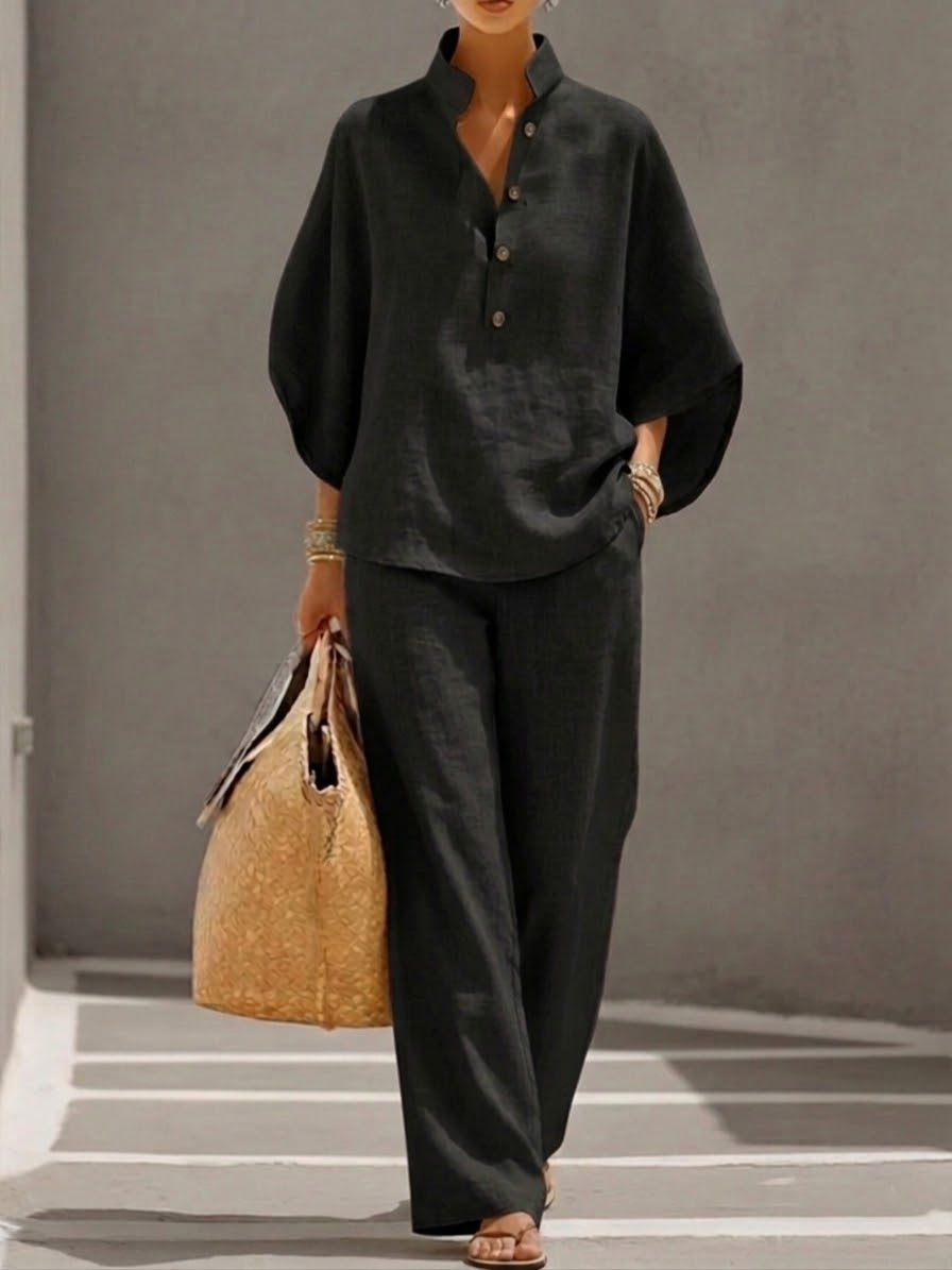 Women's suit with loose top, batwing sleeves, and straight pants