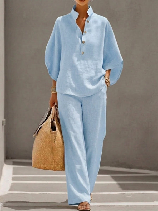 Women's suit with loose top, batwing sleeves, and straight pants