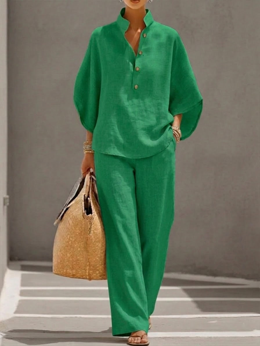 Women's suit with loose top, batwing sleeves, and straight pants