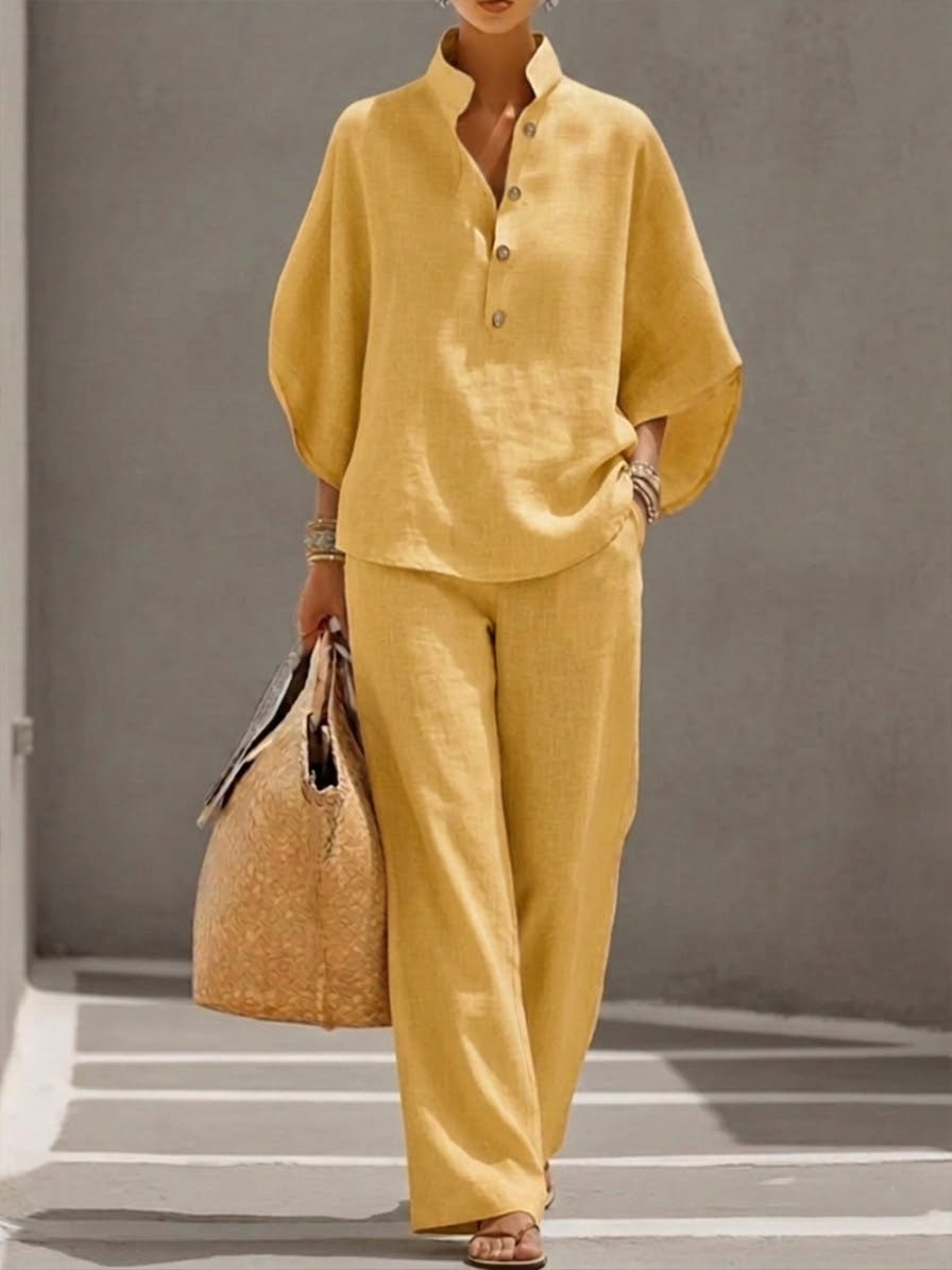 Women's suit with loose top, batwing sleeves, and straight pants
